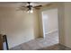 Open living space features ceiling fan and entry to another room at 2722 Penwood Pl, Lithonia, GA 30058