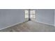 Bright bedroom with neutral carpet and a large window at 560 Woodstone Rd, Lithonia, GA 30058