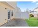 Back patio of home with white privacy fence and sliding glass doors at 79 Greystone Way, Hiram, GA 30141