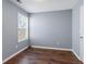 Bright bedroom featuring hardwood floors and a large window at 79 Greystone Way, Hiram, GA 30141