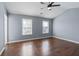 Bedroom with hardwood floors, ceiling fan, and two windows at 79 Greystone Way, Hiram, GA 30141