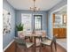 Inviting dining room with a chandelier, table setting, and door to the backyard at 79 Greystone Way, Hiram, GA 30141