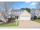 Charming two-story home with manicured lawn, a two-car garage, and inviting curb appeal at 79 Greystone Way, Hiram, GA 30141