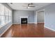 Bright living room featuring hardwood floors, a fireplace, and an ample natural light at 79 Greystone Way, Hiram, GA 30141