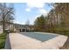 Community pool covered for the off-season, surrounded by lush trees and landscaping in the neighborhood at 247 Cavendar Way # 17, Marietta, GA 30066