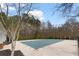 Community pool covered in winter, next to a lush landscape with manicured shrubs and trees at 247 Cavendar Way # 17, Marietta, GA 30066