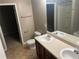 Bathroom with a double sink vanity, toilet, and shower at 3999 Riverside Pkwy, Decatur, GA 30034