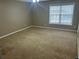 Carpeted bedroom with neutral paint and natural light at 3999 Riverside Pkwy, Decatur, GA 30034