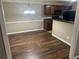 Cozy dining area adjacent to the kitchen with a modern chandelier and hardwood floors at 3999 Riverside Pkwy, Decatur, GA 30034
