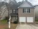 Charming two-story brick home with an attached two-car garage and well-maintained landscaping at 3999 Riverside Pkwy, Decatur, GA 30034