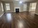 Bright living room with hardwood floors, fireplace, and access to the backyard through a door at 3999 Riverside Pkwy, Decatur, GA 30034