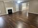 Spacious living room boasts hardwood floors, a fireplace, and natural light at 3999 Riverside Pkwy, Decatur, GA 30034