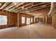 Unfinished basement with exposed wooden beams, ready for customization and expansion at 830 Garden Reserve Ln, Alpharetta, GA 30005