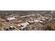 Aerial view of a multi-story building with retail space, parking, and streets in a commercial neighborhood at 360 Chambers St # 301, Woodstock, GA 30188