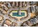 Aerial view of a community pool with a covered area surrounded by homes and landscaped areas at 360 Chambers St # 301, Woodstock, GA 30188