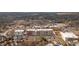 Aerial view of the neighborhood showcasing houses, streets, commercial businesses, and landscape at 360 Chambers St # 301, Woodstock, GA 30188