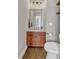 Powder room with sink, toilet, and accent lighting at 360 Chambers St # 301, Woodstock, GA 30188