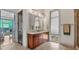 Bathroom features a double vanity with a large mirror, shower, and window at 360 Chambers St # 301, Woodstock, GA 30188