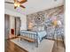 Bedroom with exposed brick wall and doorway leading to the bathroom at 360 Chambers St # 301, Woodstock, GA 30188