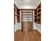 Walk-in closet with custom shelving and drawers at 360 Chambers St # 301, Woodstock, GA 30188