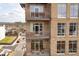 Balconies of brick building with outdoor seating at 360 Chambers St # 301, Woodstock, GA 30188