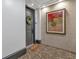 Hallway with door number 301, a decorative painting, and a welcome mat at 360 Chambers St # 301, Woodstock, GA 30188