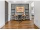 Hallway features a built-in desk with decorative ladders and an open doorway to the bedroom at 360 Chambers St # 301, Woodstock, GA 30188