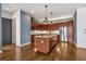 Spacious kitchen features a large island, stainless steel appliances and beautiful wood cabinetry at 360 Chambers St # 301, Woodstock, GA 30188