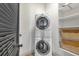 Convenient laundry room with washer, dryer, and storage shelves at 360 Chambers St # 301, Woodstock, GA 30188