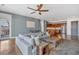 Spacious open floor plan with a kitchen and living room featuring hardwood floors and an outdoor patio at 360 Chambers St # 301, Woodstock, GA 30188