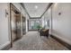Hallway area with elevators, recessed lighting, patterned carpeting, and seating near a view window at 360 Chambers St # 301, Woodstock, GA 30188