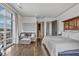 Cozy primary bedroom with wood floors, en suite bathroom, and large windows at 360 Chambers St # 301, Woodstock, GA 30188