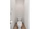 Small powder room features a white toilet at 360 Chambers St # 301, Woodstock, GA 30188