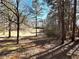 A scenic view of the property's vast, wooded backyard providing a sense of nature and privacy at 1091 Summer Lake Rd, Lithia Springs, GA 30122
