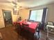 Cozy dining room featuring hardwood floors, natural light from window, and a traditional table setting at 1091 Summer Lake Rd, Lithia Springs, GA 30122