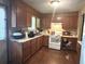 Traditional kitchen with ample cabinet space, white appliances, and laminate countertops at 1091 Summer Lake Rd, Lithia Springs, GA 30122