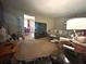 Spacious living room with plush seating, neutral carpet, and seamless flow to the dining area at 1091 Summer Lake Rd, Lithia Springs, GA 30122