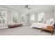 Spacious bedroom with tray ceiling, fan and plenty of natural light from multiple windows at 16 Ramsey St, Roswell, GA 30075
