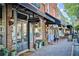 Inviting storefront with large windows, unique gifts sign, and brick accents at 16 Ramsey St, Roswell, GA 30075