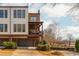 Stylish townhome with a two-car garage, covered porch, and well-maintained landscaping at 16 Ramsey St, Roswell, GA 30075