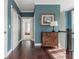 Bright hallway with hardwood floors, paneled doors, and stylish accents at 16 Ramsey St, Roswell, GA 30075