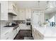 Modern kitchen features stainless appliances, oversized island, and pendant lighting at 16 Ramsey St, Roswell, GA 30075