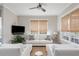 Comfortable living room with ample natural light, a ceiling fan, and cozy seating arrangement at 16 Ramsey St, Roswell, GA 30075