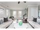 Bright living room with hardwood floors, neutral decor, and large windows at 16 Ramsey St, Roswell, GA 30075