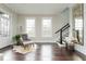 Inviting living room with hardwood floors, natural light, and stylish decor at 16 Ramsey St, Roswell, GA 30075