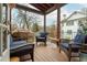 Relaxing covered porch with comfortable seating and neighborhood views at 16 Ramsey St, Roswell, GA 30075