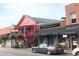 Charming street view featuring shops and restaurants with colorful facades and inviting storefronts at 16 Ramsey St, Roswell, GA 30075