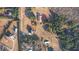 Expansive aerial view showcasing the property's layout, including home, large lot, detached garage, and surrounding trees at 4180 Mount Paran Dr, Social Circle, GA 30025