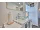 Bright bathroom featuring a modern glass vessel sink and stylish white vanity at 4180 Mount Paran Dr, Social Circle, GA 30025