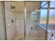 The tiled shower features a corner seat and a showerhead at 4180 Mount Paran Dr, Social Circle, GA 30025